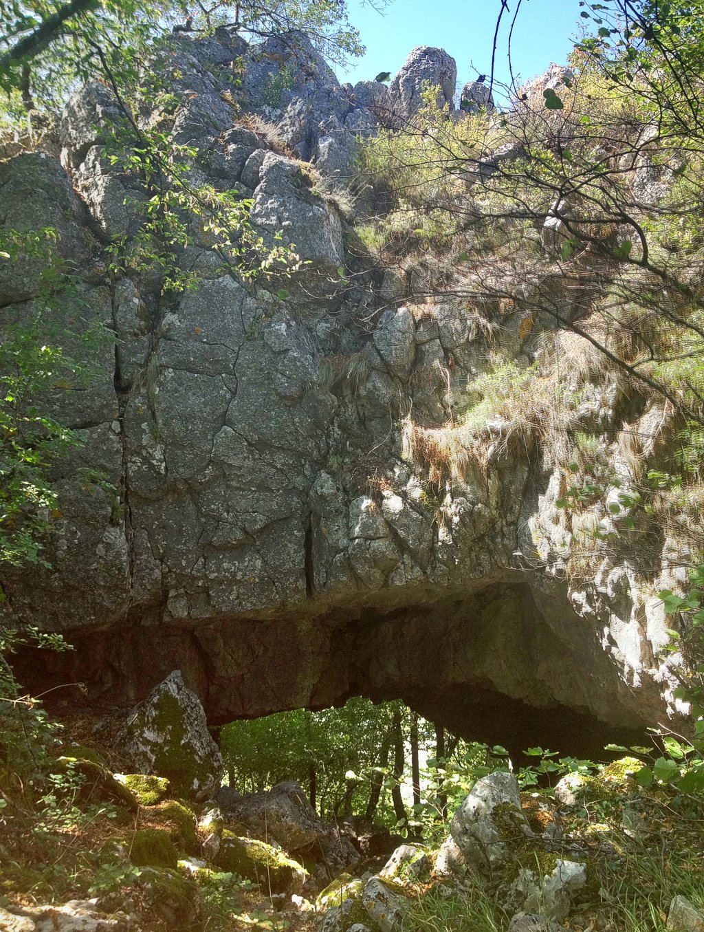The natural stone arch near Sisol on the Krševiti ridge.