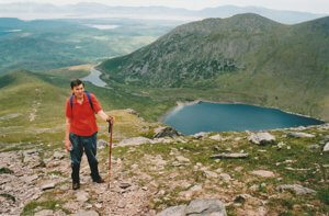 Ascent of Caher with Lough Coomloughra below. Coomloughra Horseshoe, Ireland.